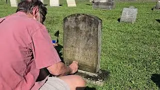Cleaning the headstone of George Marsh