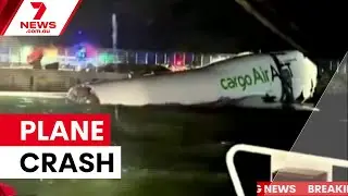 Cargo plane crashes at Hong Kong airport | 7NEWS