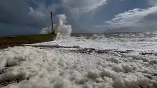 Sea foam and stormy seas.. British summer! East Sussex, UK