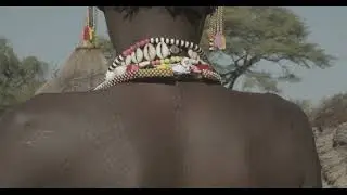 Larim tribe woman with traditional decorations on the head, Boya Mountains, Imatong, South Sudan