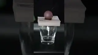 How many playing cards will be burned through if a 1000&deg;C iron ball is placed on them?
