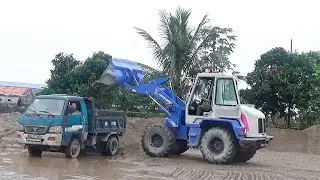 NEW PROJECT: Mitsubishi wheel loader loading sand and gravel onto dump trucks.