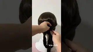 The textured and elegant flower bud bun hairstyle is sophisticated and intellectual. The r