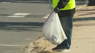 Staff and clients at the Chrysalis Center pick up trash in Hartford