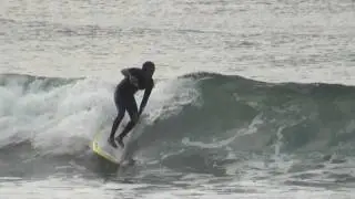Anthony Vela and Candice Appleby surfing in San Diego