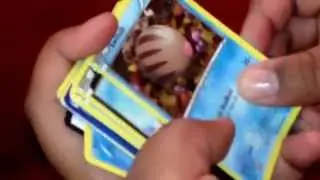 Opening pokemon card thundurus tin