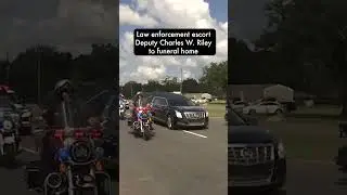 Law enforcement escort body of Deputy Charles W. Riley