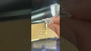 Round diamond engagement ring with round and marquise side diamonds