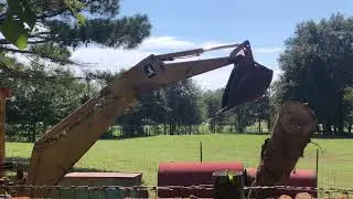I&rsquo;m scared to watch! Never moved logs like that before! Unloading Logs With A Backhoe