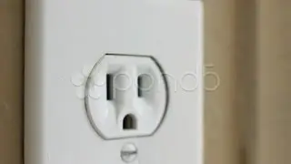 INSERT PLUG INTO WALL SOCKET. Stock Footage