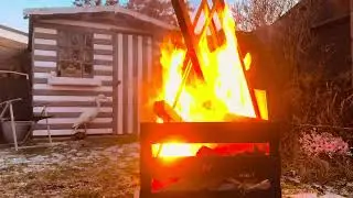 Log fire in front of garden shed in Hellesdon, Norwich UK garden. Sunday 4th January 2026.