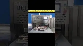 chocolate layer cake cut into squares with an ultrasonic cake cutter machine