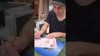 Artist Simone Legno of tokidoki Signing a Certificate of Authenticity for an Original Painting