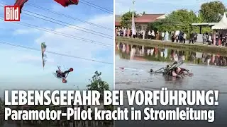 DRAMATISCHER UNFALL: Paramotor-Pilot kracht in Stromleitung &ndash; Dann st&uuml;rzt er ins Reisfeld