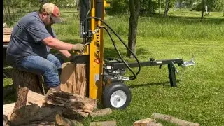 Splitting with a 25 ton CountyLine log splitter and stacking firewood