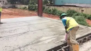 Video showing application of ARMORTOP HD200  emery grade monolithic floor hardener on factory floor.