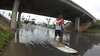 Morning SUP at flooded bridge underpass to Coronado Cays during Winter storm