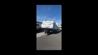 Location of switch for rear stabilizer jacks on Prime Time Tracer travel trailer