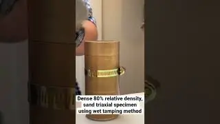 Dense sand triaxial specimen using wet tamping preparation method