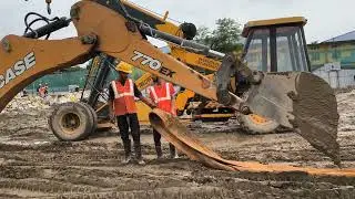 Transit mixer stuck in muck .. jCB pulling out from it