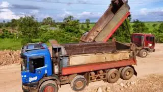 Greatest teamwork fast filling substrate foundation stretching by expert dozer d41p &truck unloading