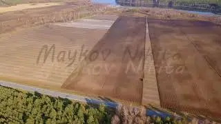 The tractor plows a field with fertilizers. Autumn, Russia, From Dron