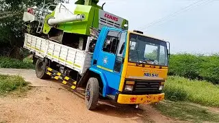 Claas Crop tiger Harvester unloading and loading on a Ashok Leyland truck