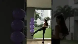 balloon kicking Taekwondo black belt Girl