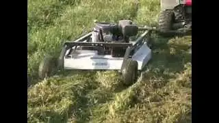 Kunz AcrEase Pull Behind Rough Cut Mower Towed By An ATV