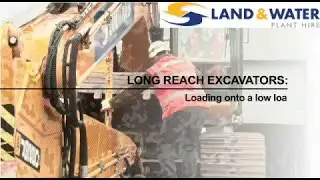Loading a long reach excavator onto a low loader