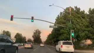 Driving on the famous Katella ave passing by Anaheim Convention Center, Disney California Adventure