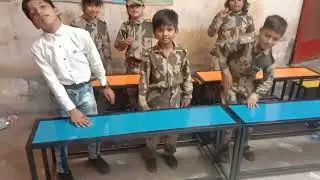 Students r learning color name and different things name in action game. 