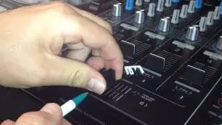 Removing the P-Lock fader caps on a Pioneer mixer.