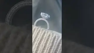 Iced out radiant cut engagement ring on thin round band
