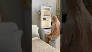 (419) ▶️ This makeup vanity table has a sleek mirror surrounded by bright lights.
