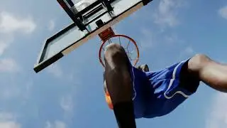 VideoVault Stock Video: Basketball player doing a dunking