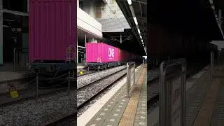 Korail Class 8500 electric locomotive 8580 leads a container freight train through Suwon Station