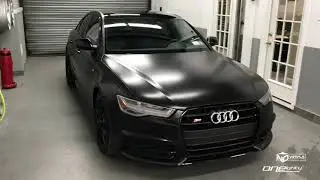 Audi S6 wrapped in Satin Black with gloss Black Accents and Painted Red calipers