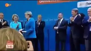 Angel merkel rejeita bandeira da Alemanha e joga fora!