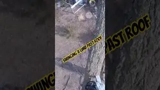 Swinging a branch over the roof #rigging #arborist #climbing