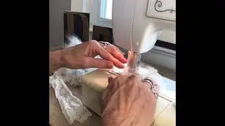 Creating a winter white felted brooch.