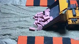 Watch the Bulldozer and Truck work the DIY site.