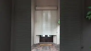 Motorized Rolling Hurricane Shutter over Entrance Door
