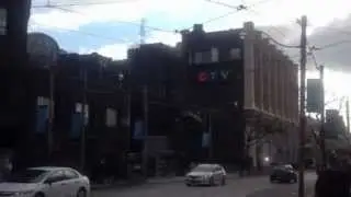 CP24 Breaking News Building has a news truck bursting out