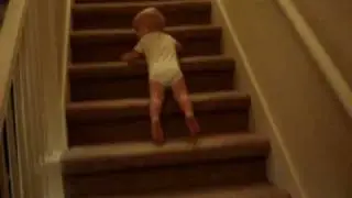 Baby sliding down stairs