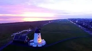 Lytham St Annes sunset, windmill, pier and beach shot from above with drone