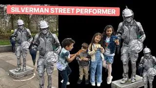 Silver man statue street performer London