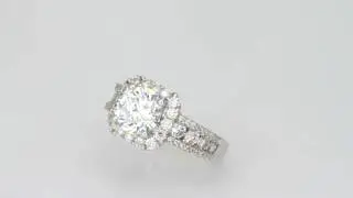 Diamond engagement ring set with over one carat of accent diamonds.