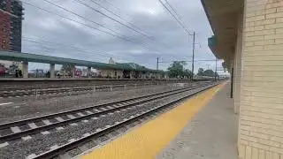 A Amtrak Northeast Regional 608 train speeds through Rahway station 