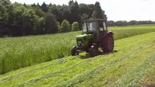 Deutz Fahr 6807c mit Deutz KM 24 beim Mähen